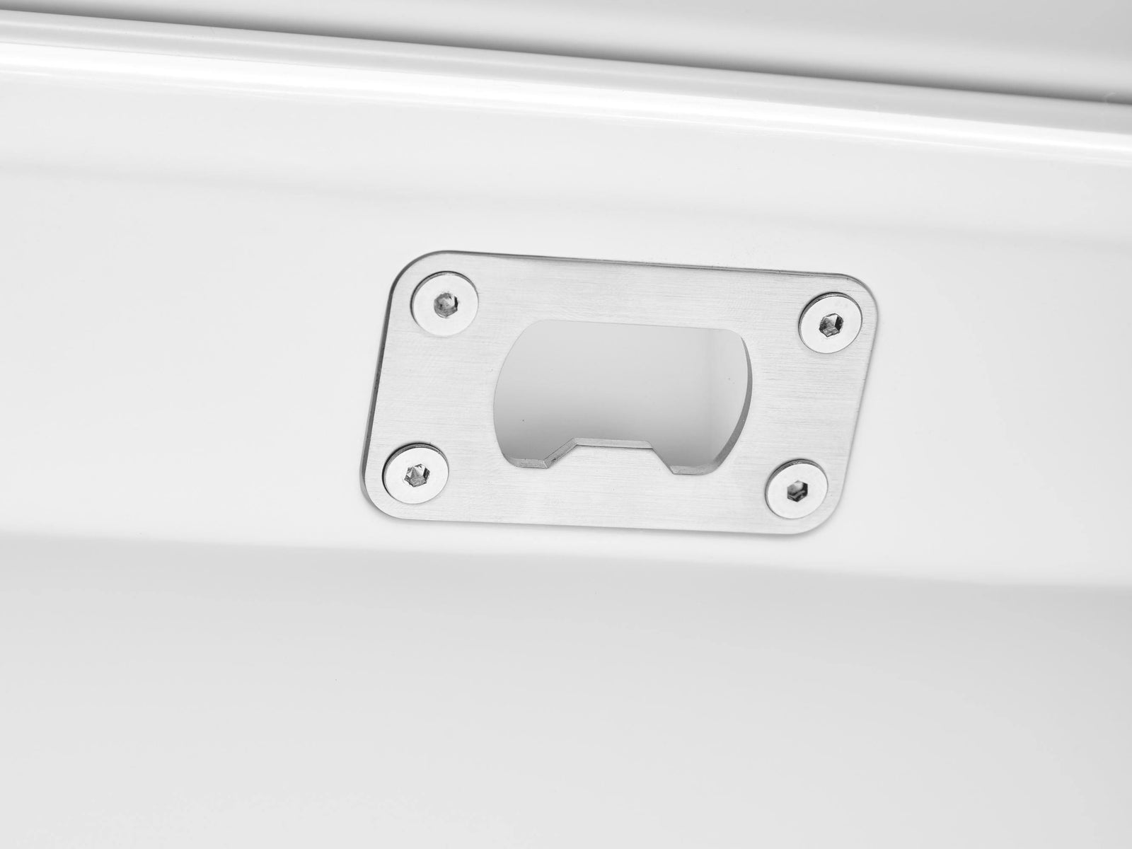 Metallic plaque with screws on a white background