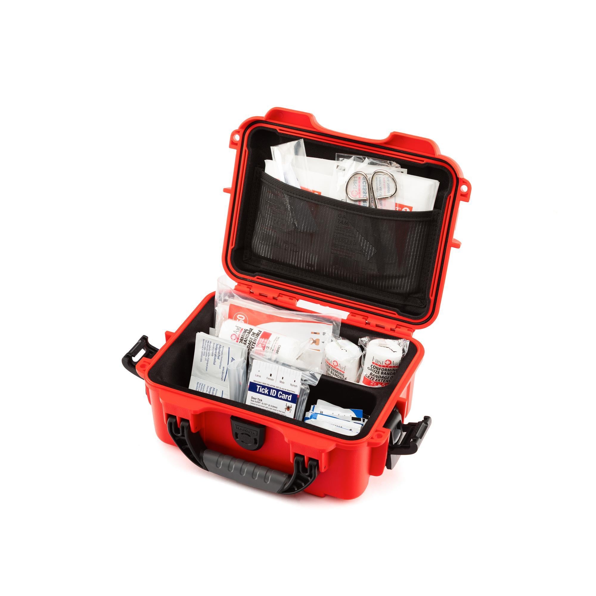 Red first aid kit with supplies on a white background