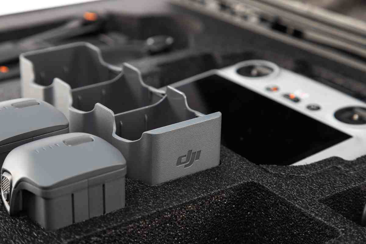 Gray DJI battery case with two batteries inside a protective foam container.