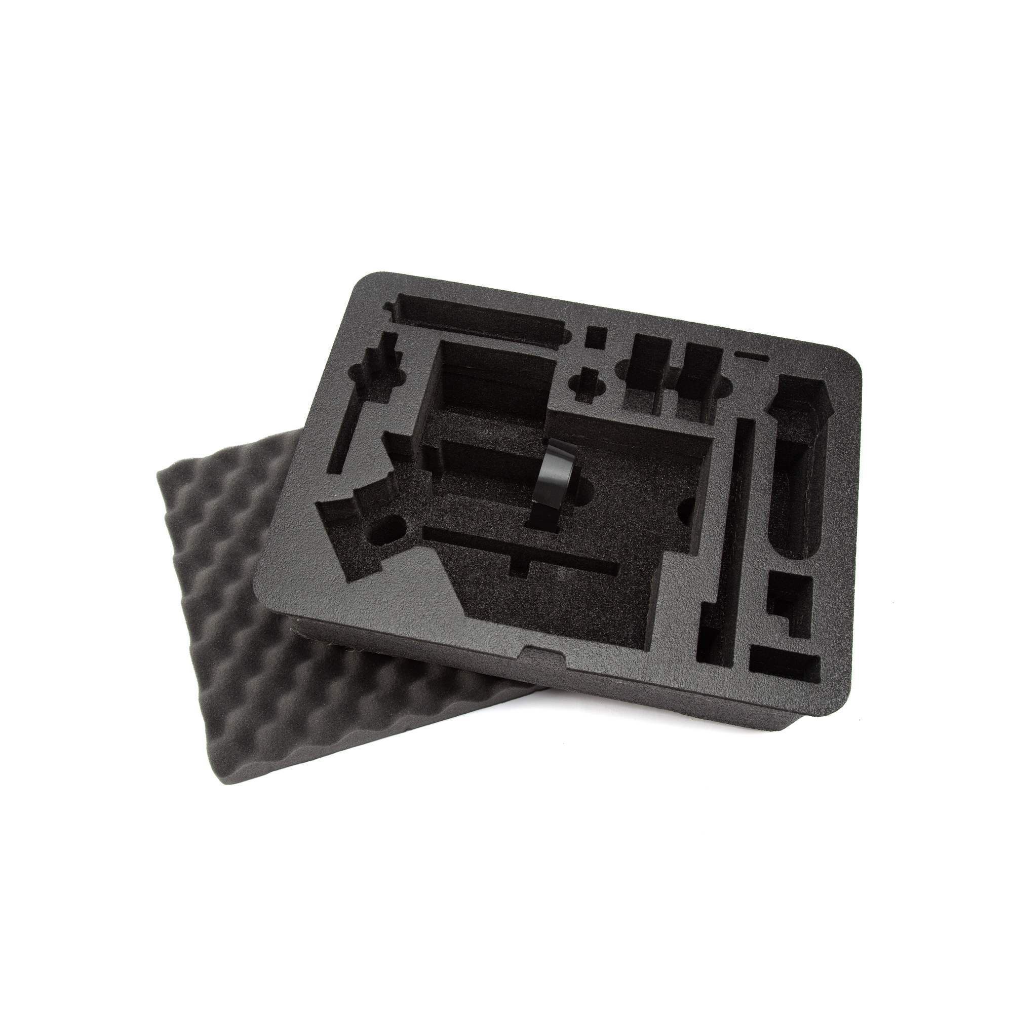 Black foam packaging insert on a white background Black foam packaging insert on a white background