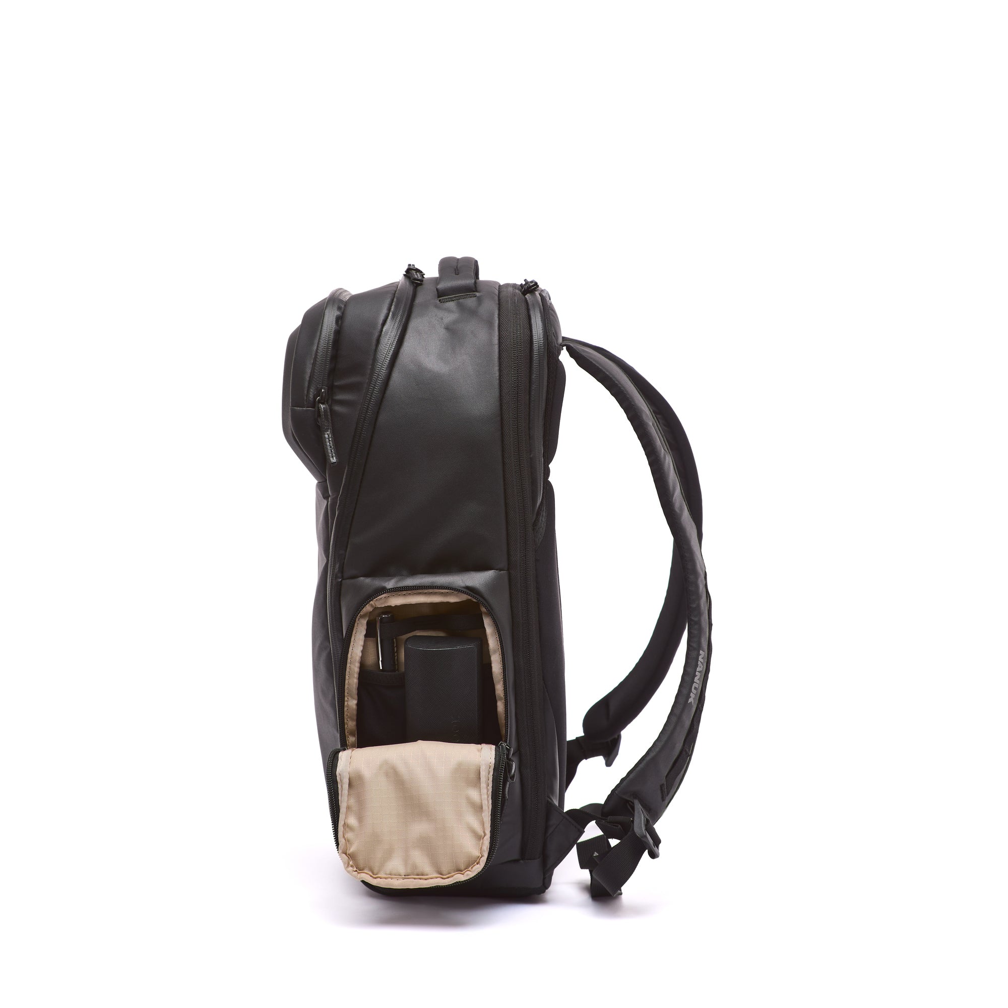 Black backpack with a beige interior pocket on a white background Black backpack with a beige interior pocket on a white background