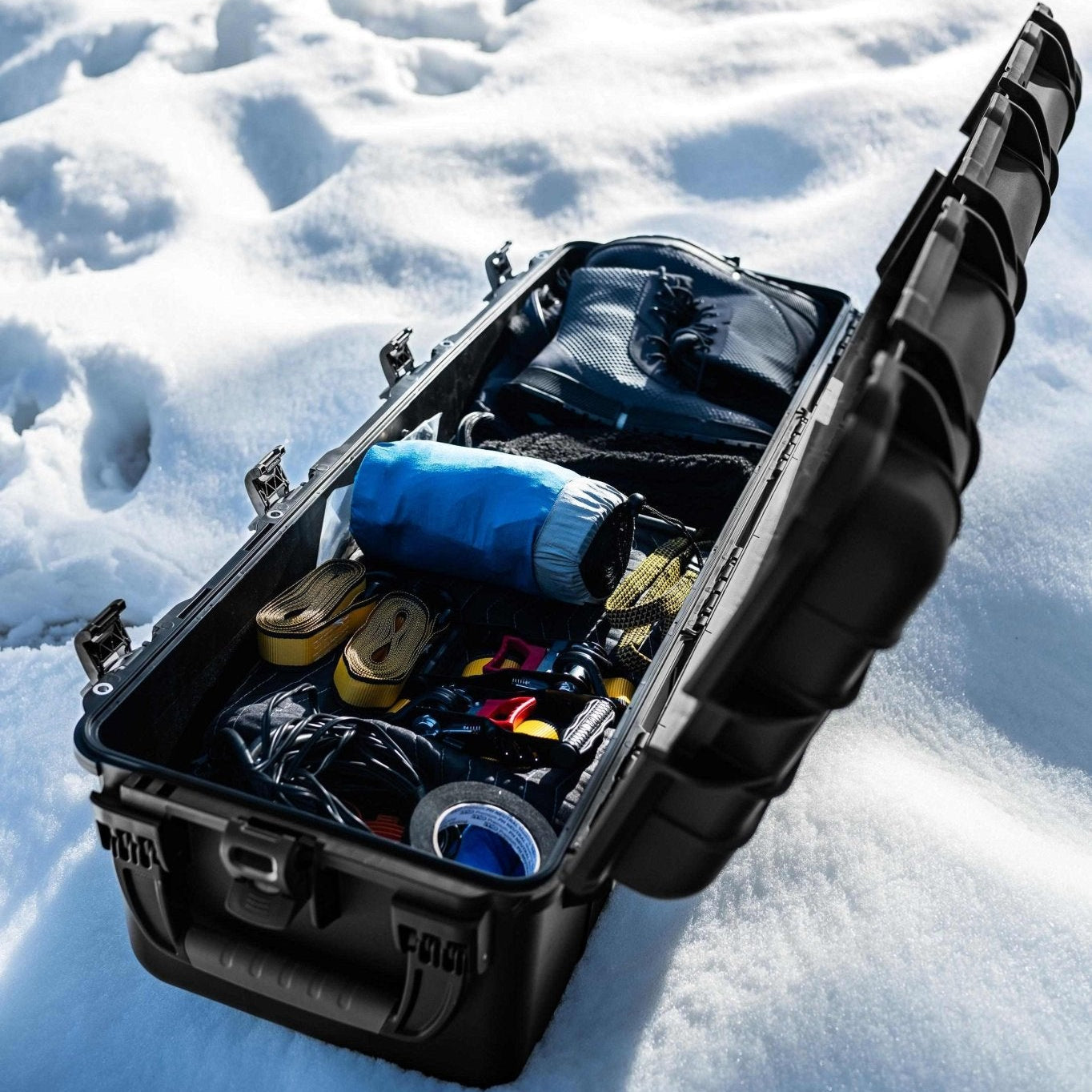 Black tool case with tools on a snowy ground Black tool case with tools on a snowy ground