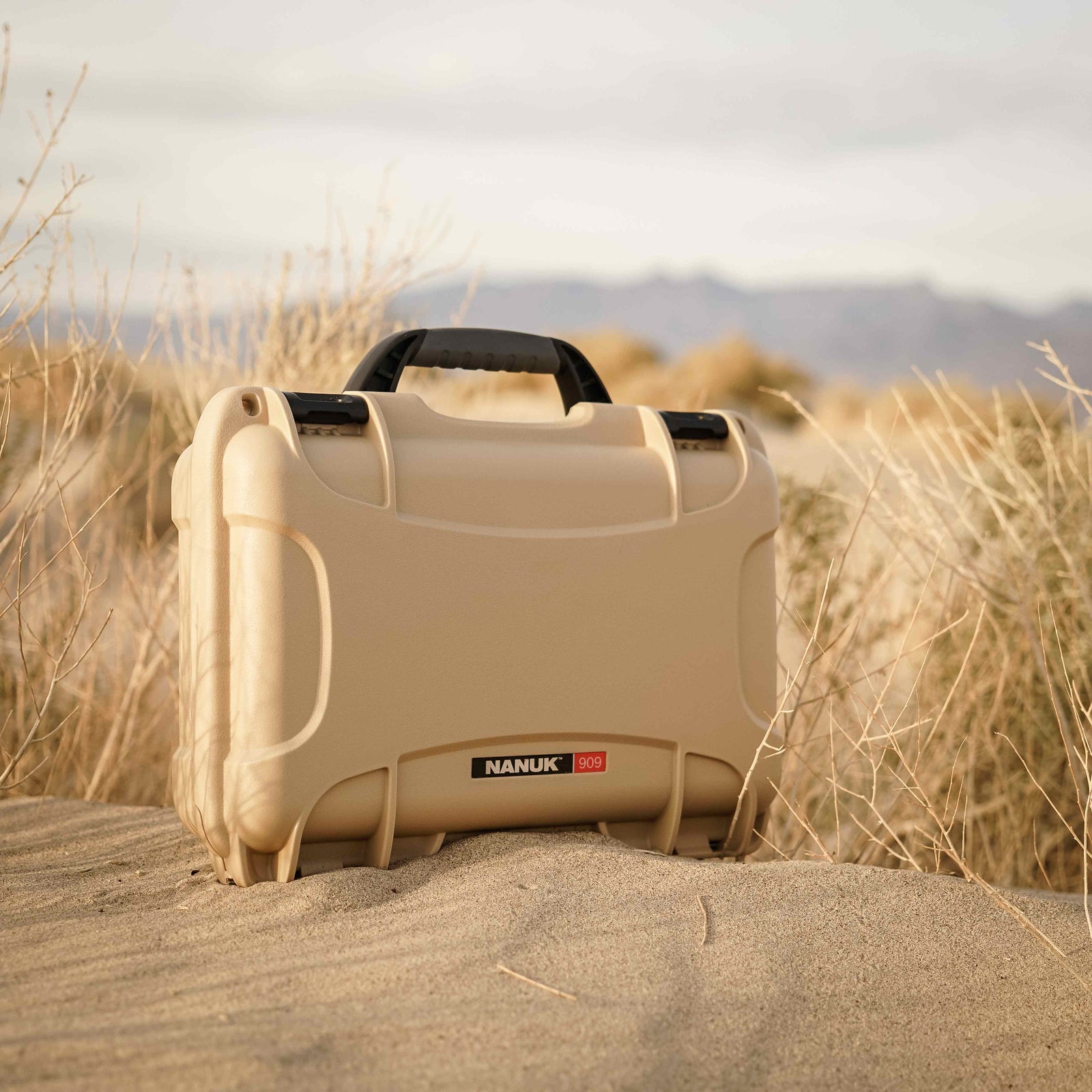 Compact and sturdy NANUK 909 hard case in tan, perfectly suited for harsh desert conditions.