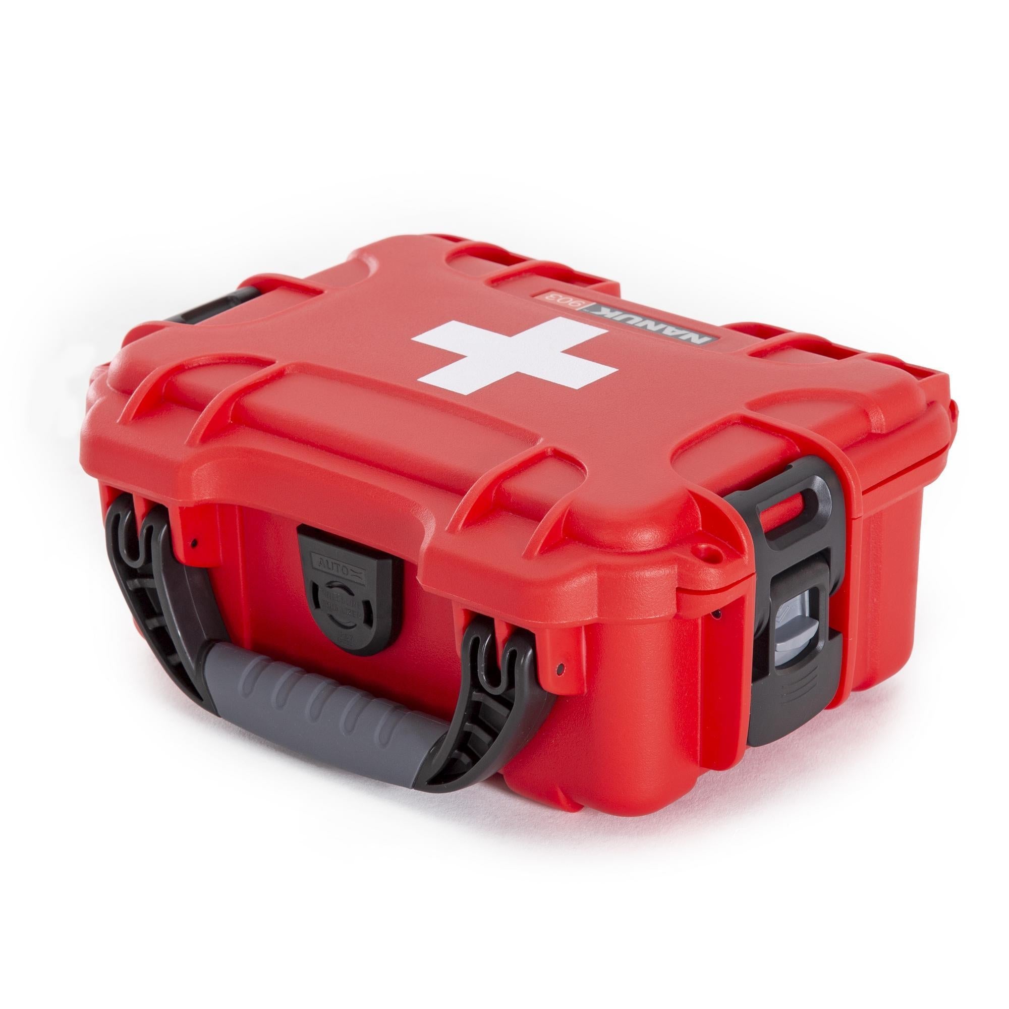 Red first aid kit with a white cross symbol on a white background Red first aid kit with a white cross symbol on a white background