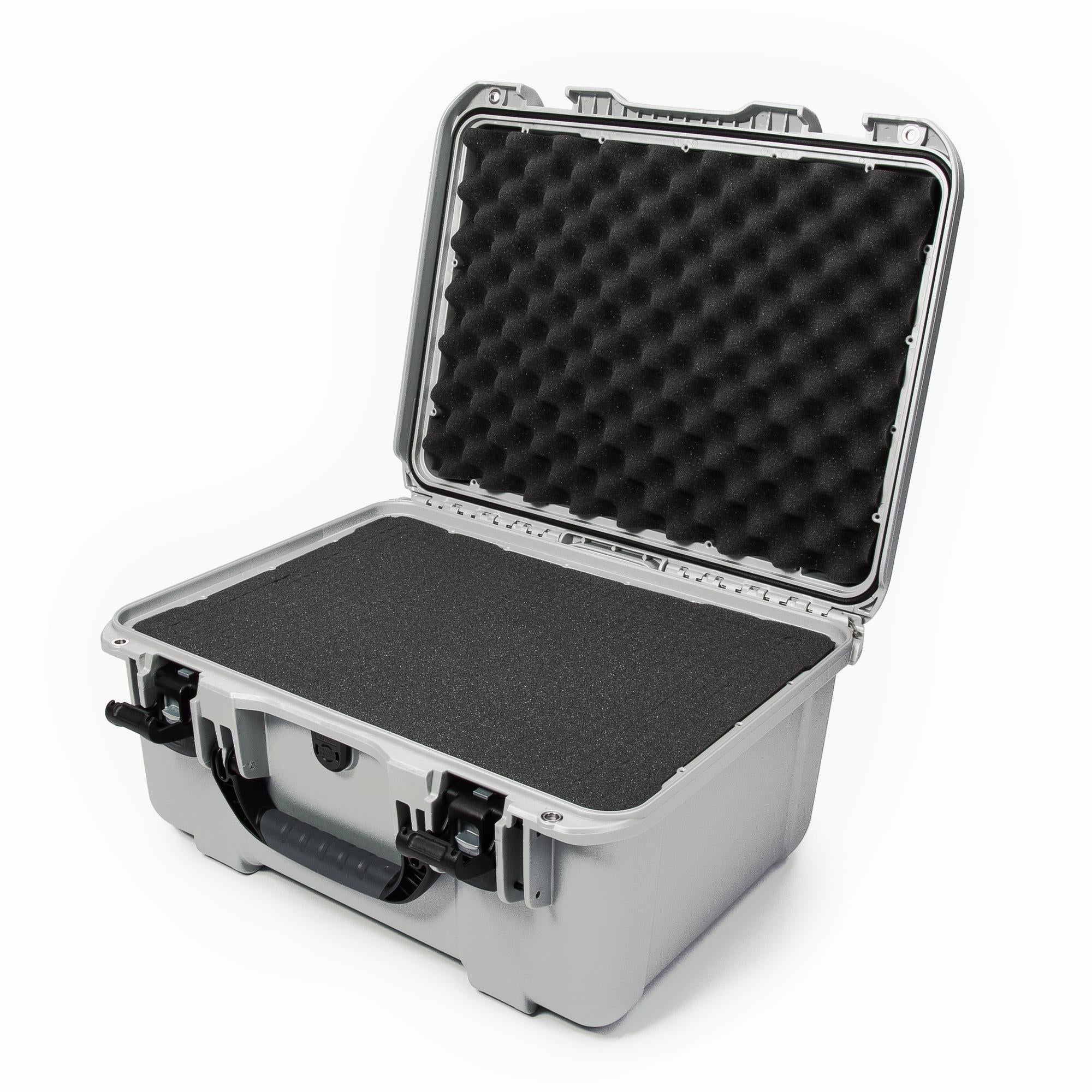Silver hard-shell protective case with black foam interior on a white background Silver hard-shell protective case with black foam interior on a white background