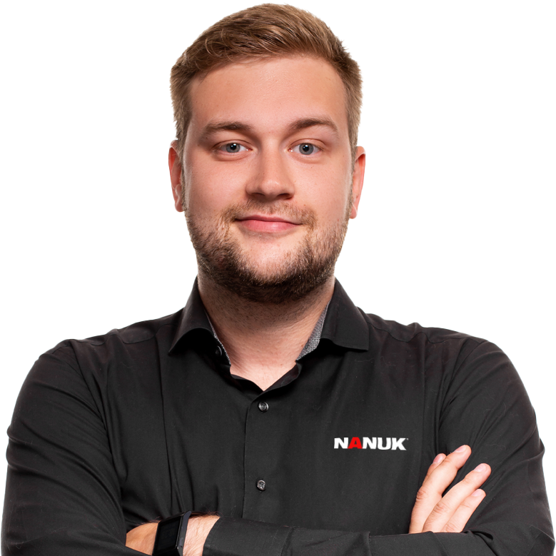 Man wearing a black shirt with 'NANUK' logo on a white background