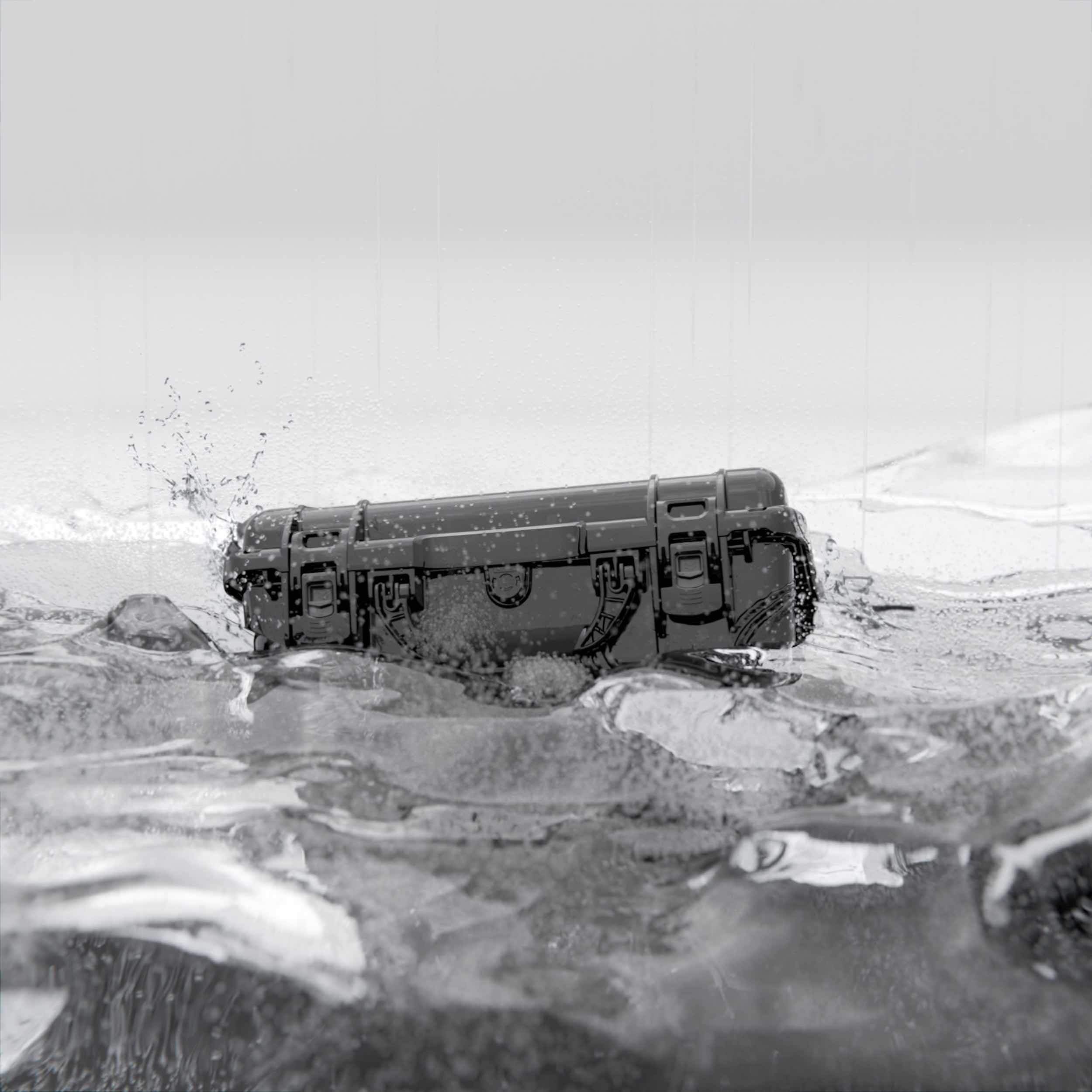 Black NANUK hard case in water, demonstrating waterproof and durable protection for gear