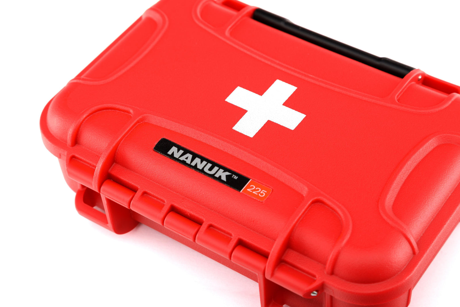 Red first aid kit with a white cross and Nanuk logo on a white background