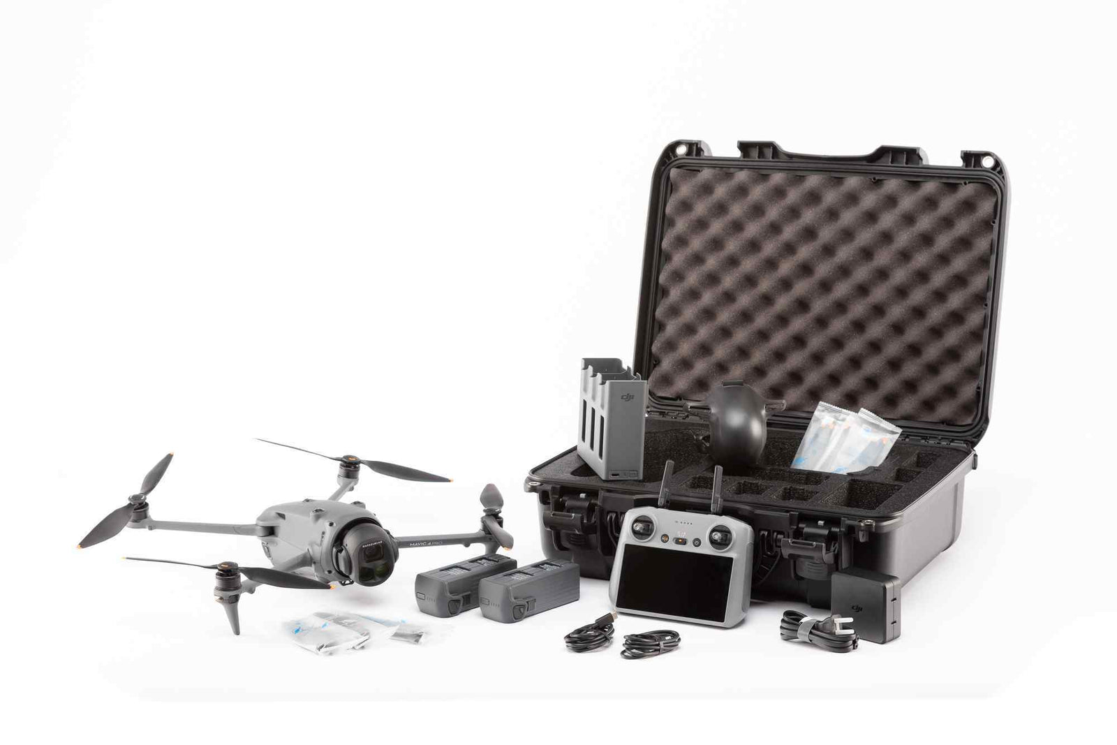 Drone with accessories and a black case on a white background
