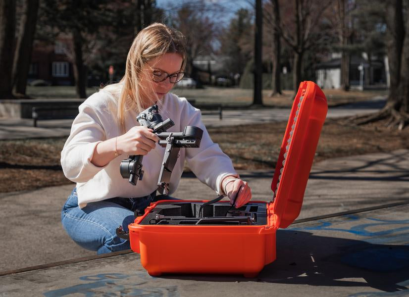 Photographer using the DJI Ronin RS4 with the Nanuk 930 Ronin RS4 Orange