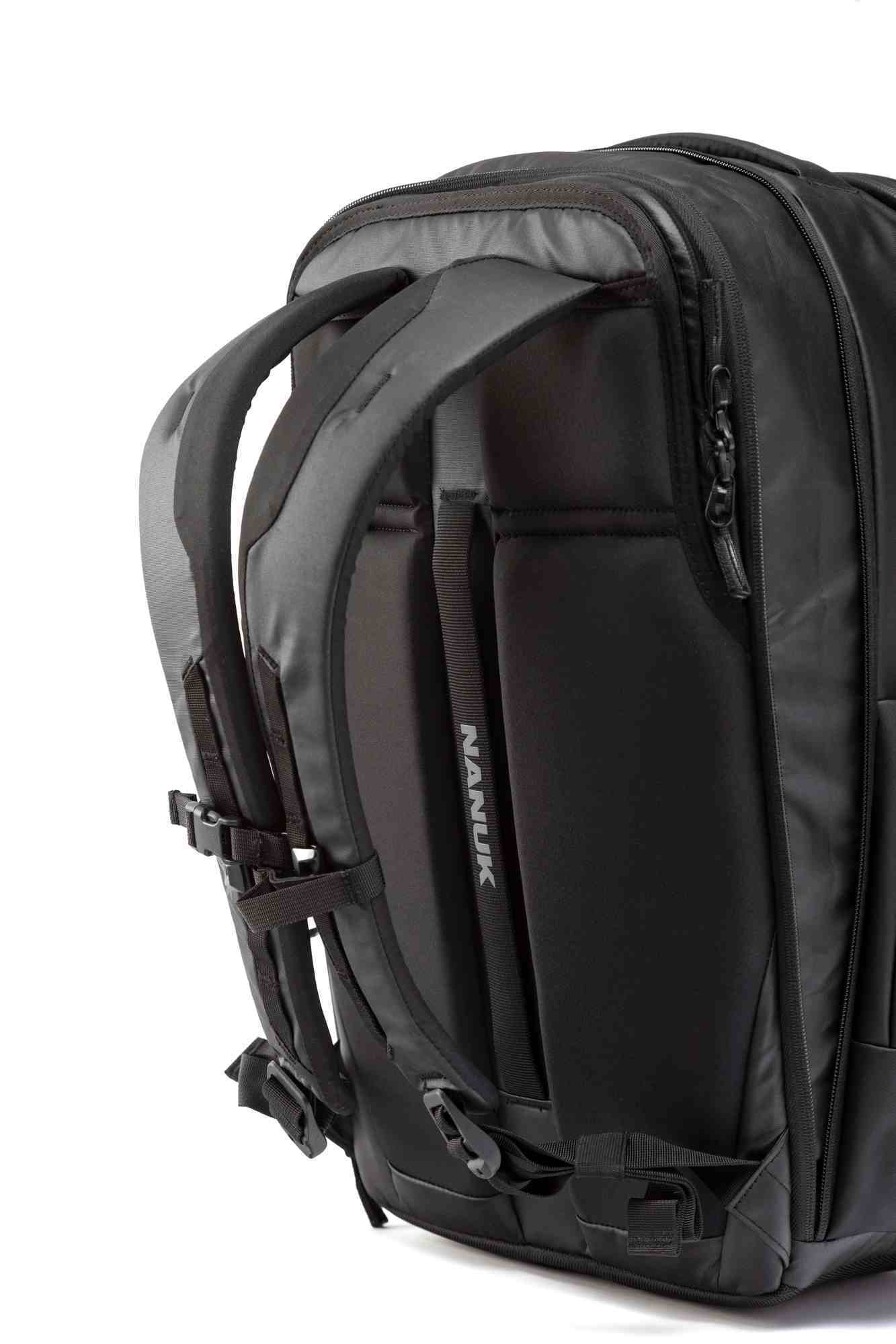 Black backpack with visible Nanuk branding on a white background