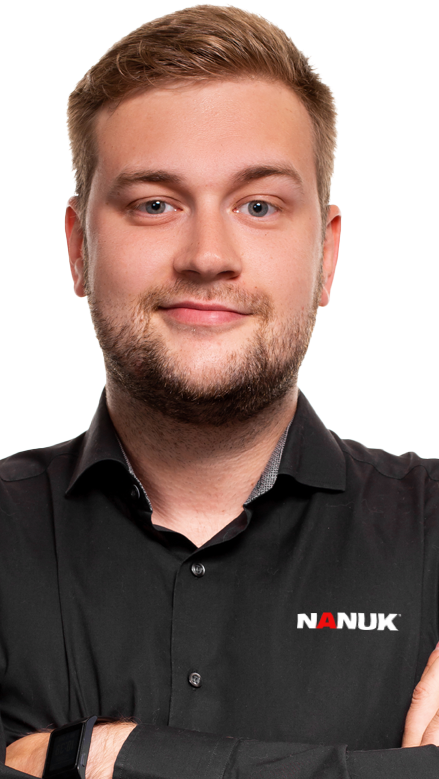 Man wearing a black shirt with 'NANUK' logo on a white background