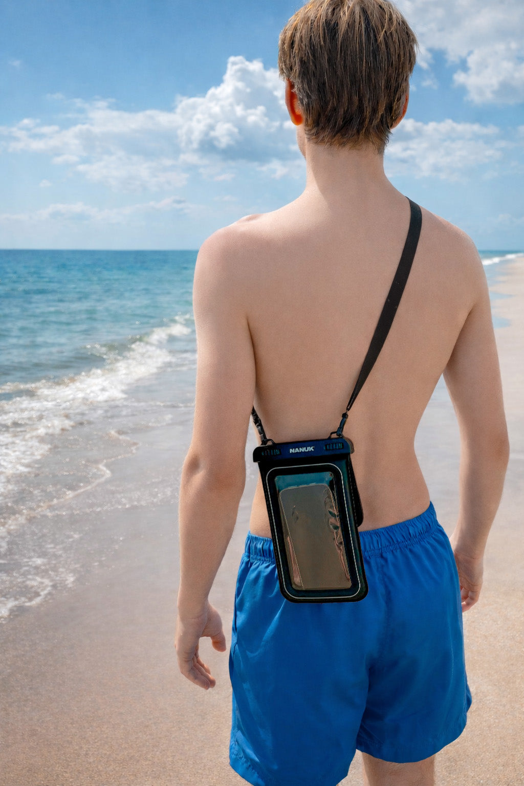 Person on a beach wearing a waterproof phone case